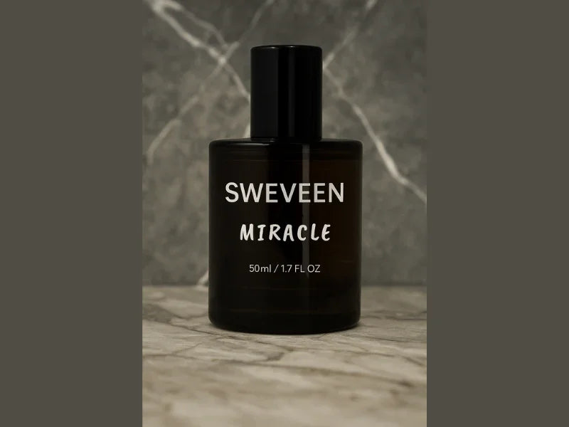 A brown cylindrical perfume bottle with a black cap, labeled "SWEVEEN MIRACLE".