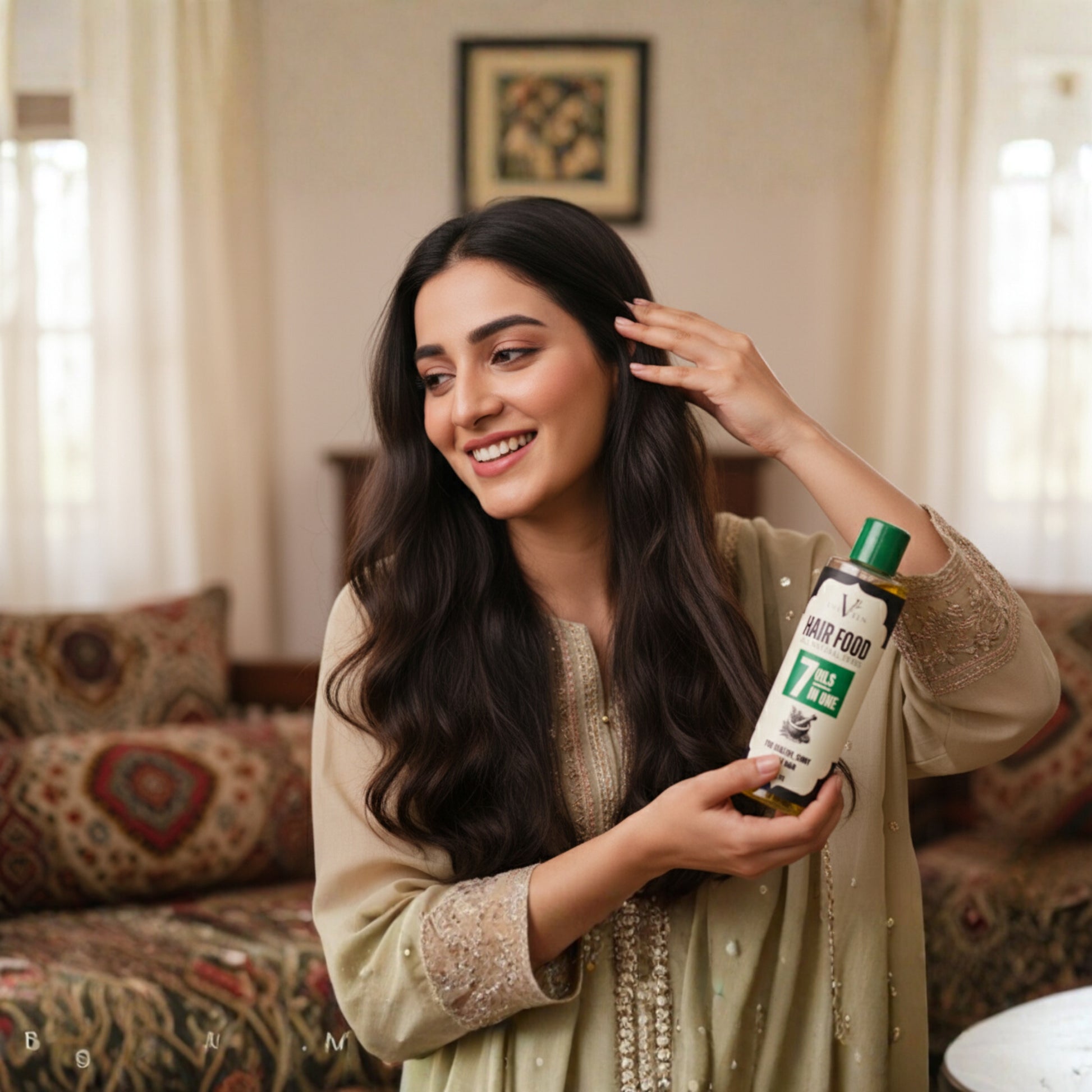 Woman with long dark hair holding a bottle labeled 'Hair Food' in a living room setting.