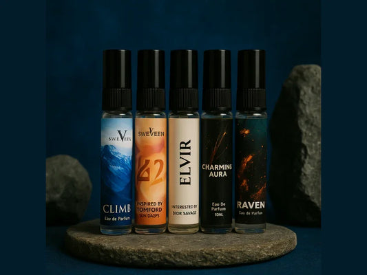 Five roll-on perfume bottles on a gray stone base.