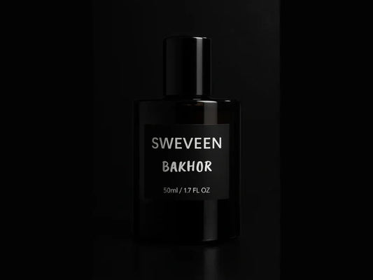 Black perfume bottle with silver text.